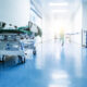 Doctors or nurses walking in hospital hallway, blurred motion.