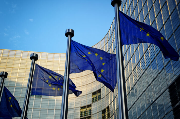 EU flags in front of European Commission building in Brussels