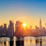 Golden sunrise over New York City's skyline.