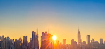 Golden sunrise over New York City's skyline.