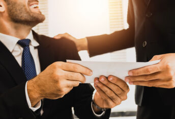 close up hand of employee receive bonus from manager