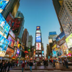 Amazing vibrant Times Square crowded with tourists and people sightseeing. New York City, Manhattan, USA.