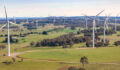 Aerial drone view of an array of large wind turbines at Biala and Gullen Range Wind Farm, Bannister in the Southern Tablelands region of New South Wales, Australia on a sunny day