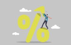 Why sustainability-linked loans should be a talking point An illustration of a percentaeg symbol being assembled by a man