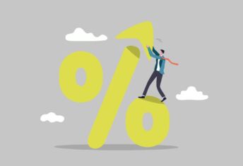 Why sustainability-linked loans should be a talking point An illustration of a percentaeg symbol being assembled by a man