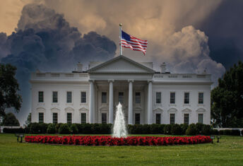 The White House with a stormy sky above.