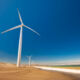 Ninety One eyes launch of global EM infrastructure debt strategy targeting up to $1bn Wind turbines along ocean shore sustainable and renewable energy landscape view