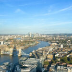 London, England, 14 September 2023: Tower Bridge, Canary Wharf and the London city skyline seen from high up.